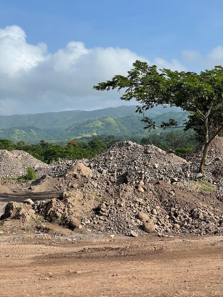Aggregate stockpiles at Morgan's Pass — historical photo from prior quarry operations, no plant on site
