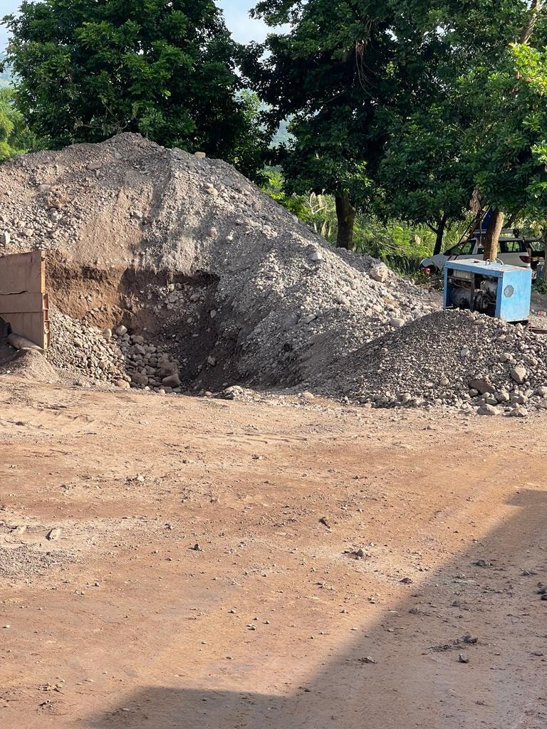 Gravel stockpile from prior quarry operations — no longer present on site